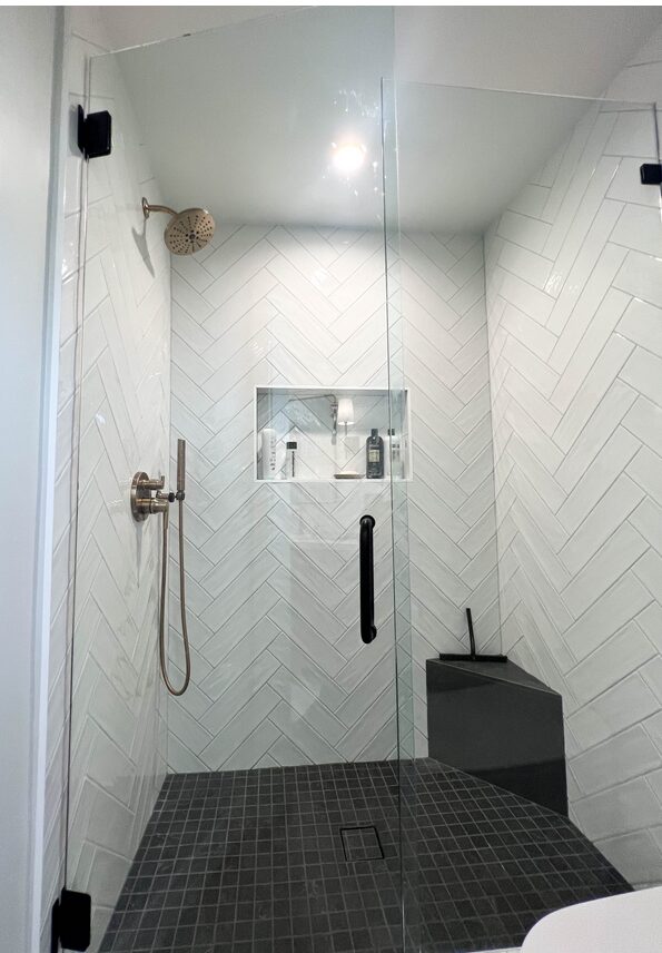 Mission Viejo shower remodel with black floor time and white wall tile