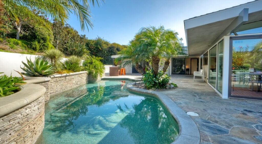 Back yard of home with swimming poos listed for sale by Dana Point real estate agents