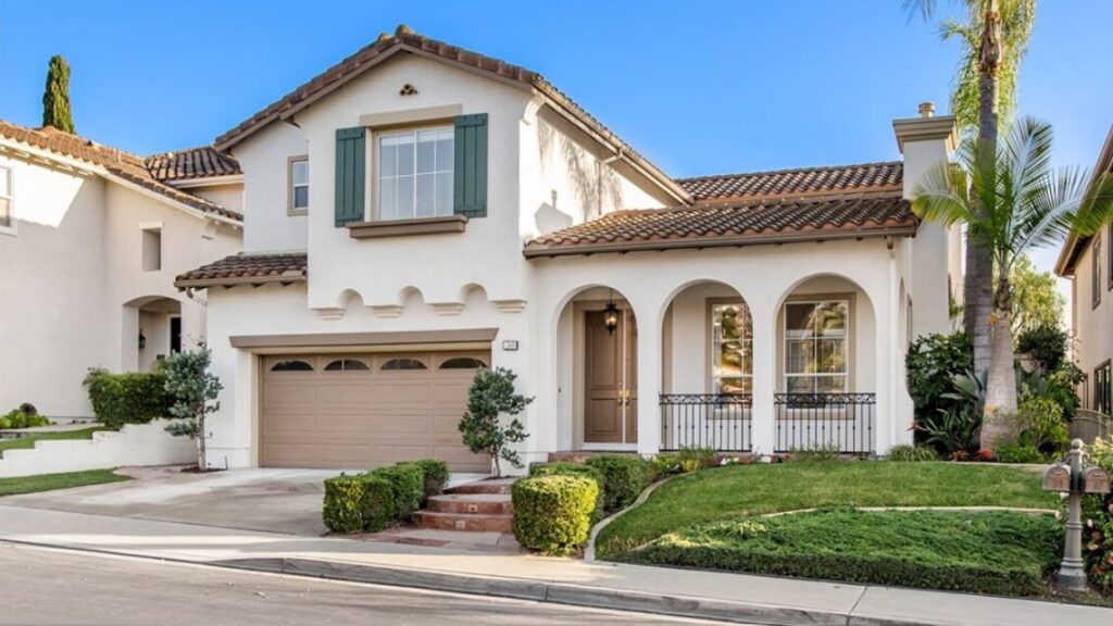 Aliso Viejo real estate companies home for sale listing of beige house with brown tile roof