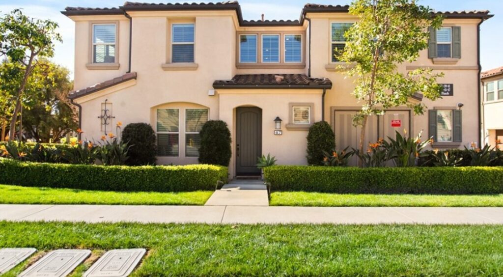 front of large house listed for sale by Lake Forest real estate broker